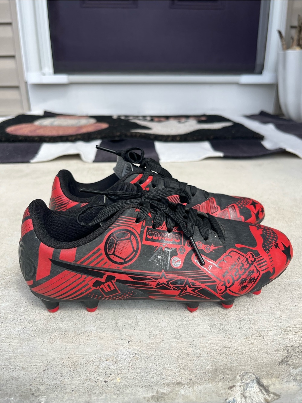 Puma Kids Black and Red Soccer Cleats with Graphic Print